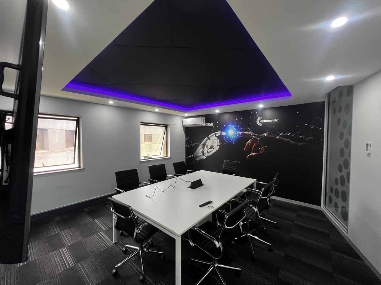 Modern conference room renovation in Johannesburg featuring ergonomic furniture and integrated tech.
