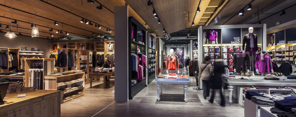 Retail store interior with accent lighting highlighting product displays and creating a welcoming shopping atmosphere