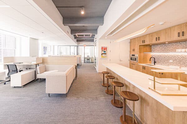 Modern, fully furnished office interior with glass partitions and branded furniture — showcasing the results of a Tenant Installation Allowance.